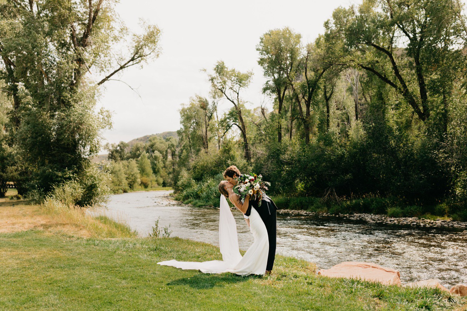 Bride and Groom Kissing at 4U Ranch Utah Wedding