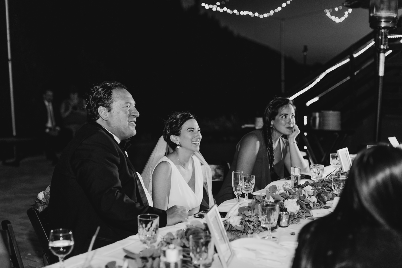 Bride and Groom laughing during wedding toasts