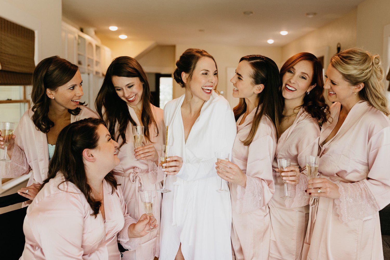 Bride and bridesmaids robe photos with champagne