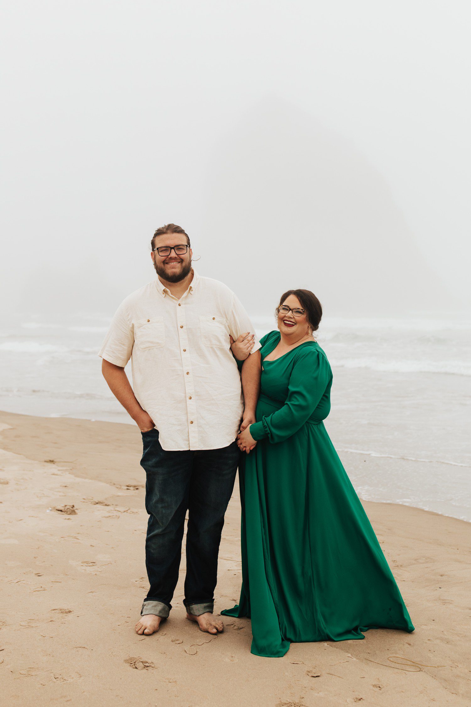 Couple smiling for elopement at cannon beach