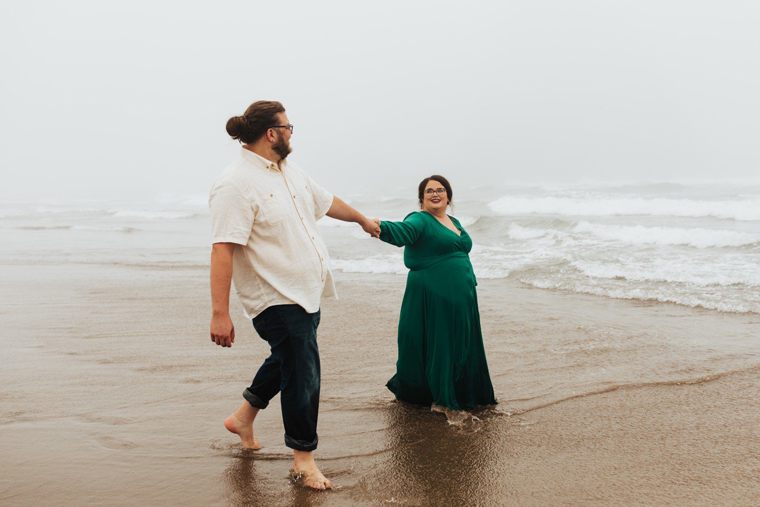 Couple Walking in Ocean on Cannon Beach