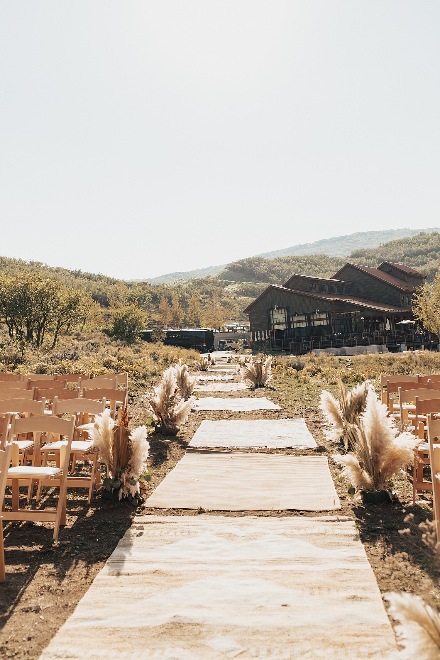 stone pathway at venue leading to outdoor ceremony by Nicole Aston Photography