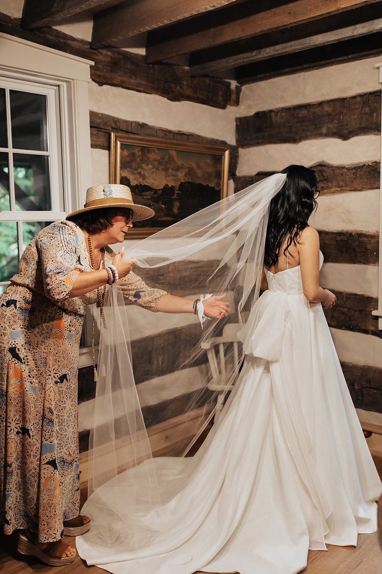 mother fixes her daughter's veil before big day by Destination wedding photographer