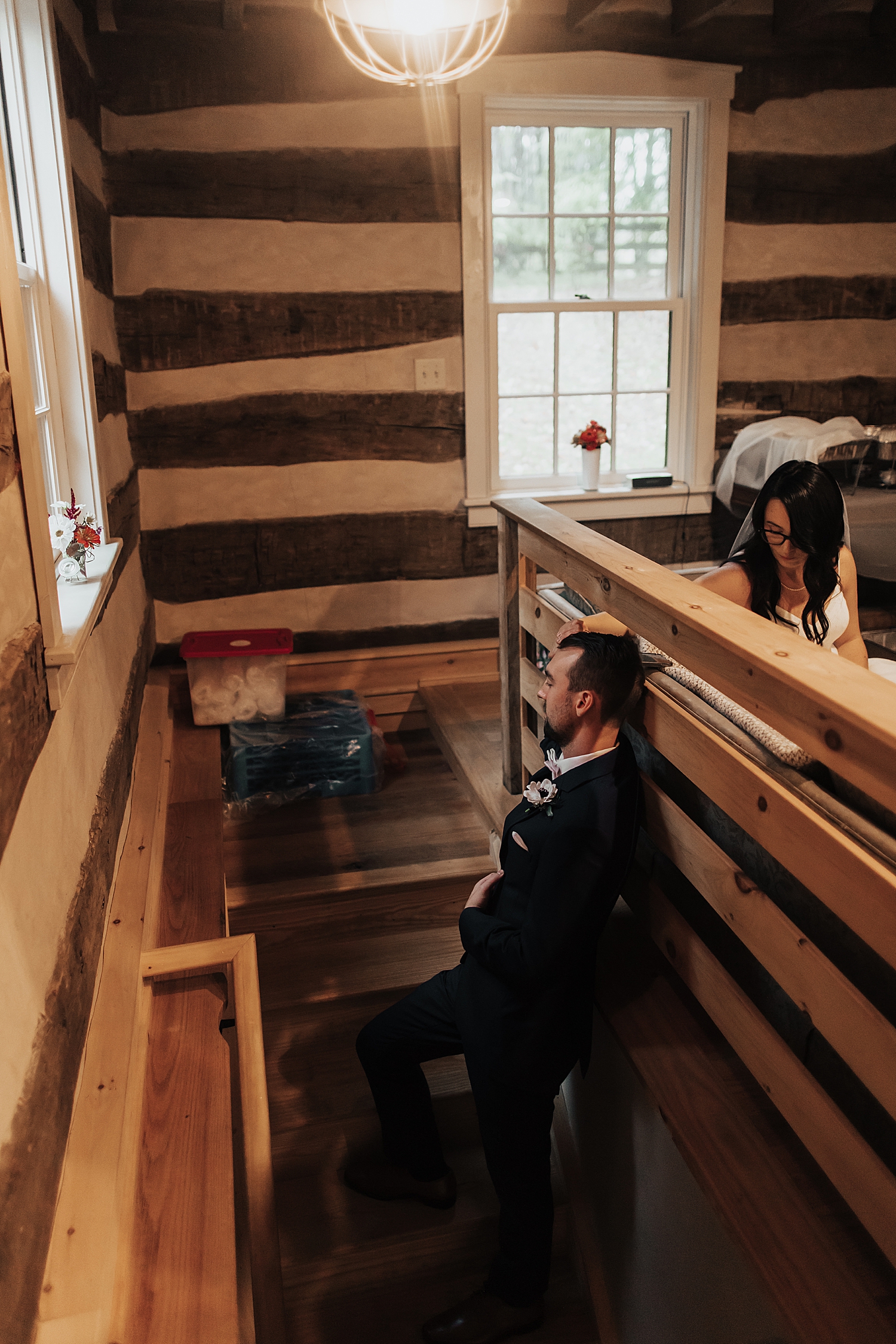 man holds his fiance's hand for first touch by Nicole Aston Photography