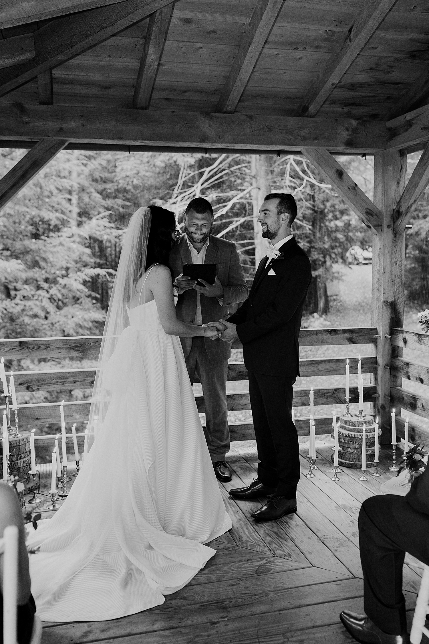 man and woman stand on porch to say i do by Destination wedding photographer