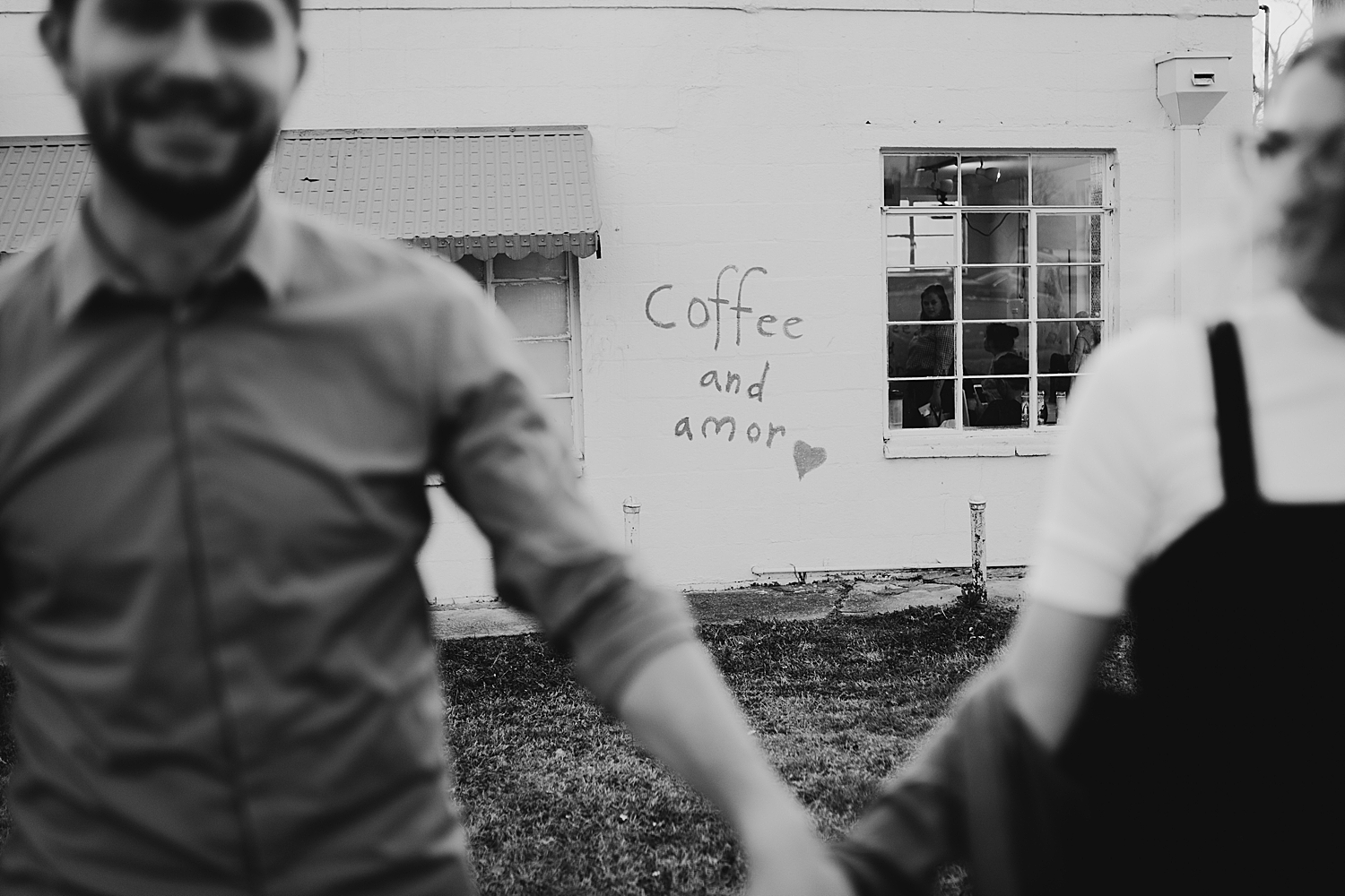 couple runs near coffee mural for Downtown DFW Couples Session