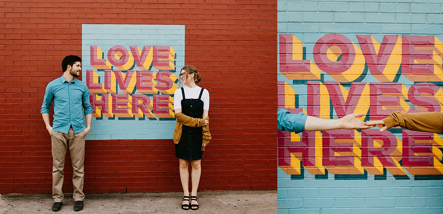 husband and wife smile at each other across colorful mural by Destination Wedding Photographer