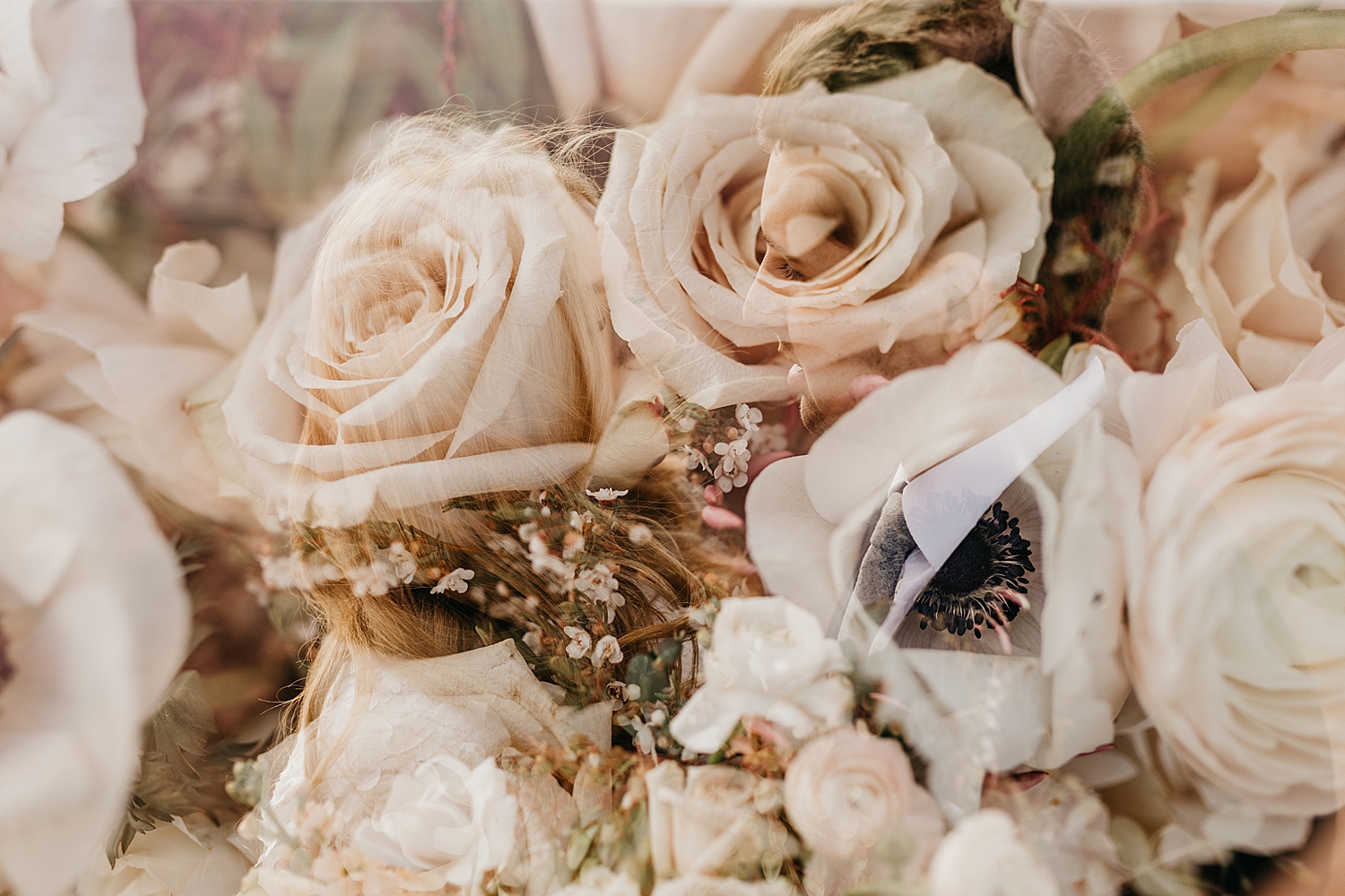 bride and groom look at each other with roses everywhere by Nicole Aston Photography