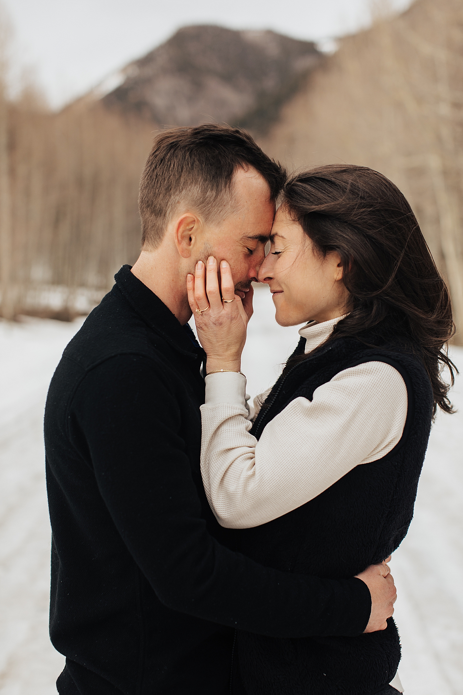 husband and wife to be embrace in the cold by Nicole Easton Photo