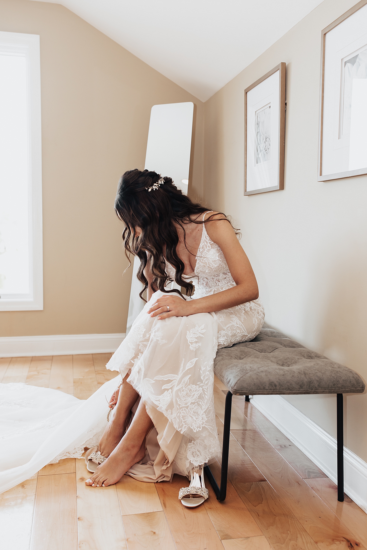 bride leans down to slip into shoes for Moody Wedding in New Jersey