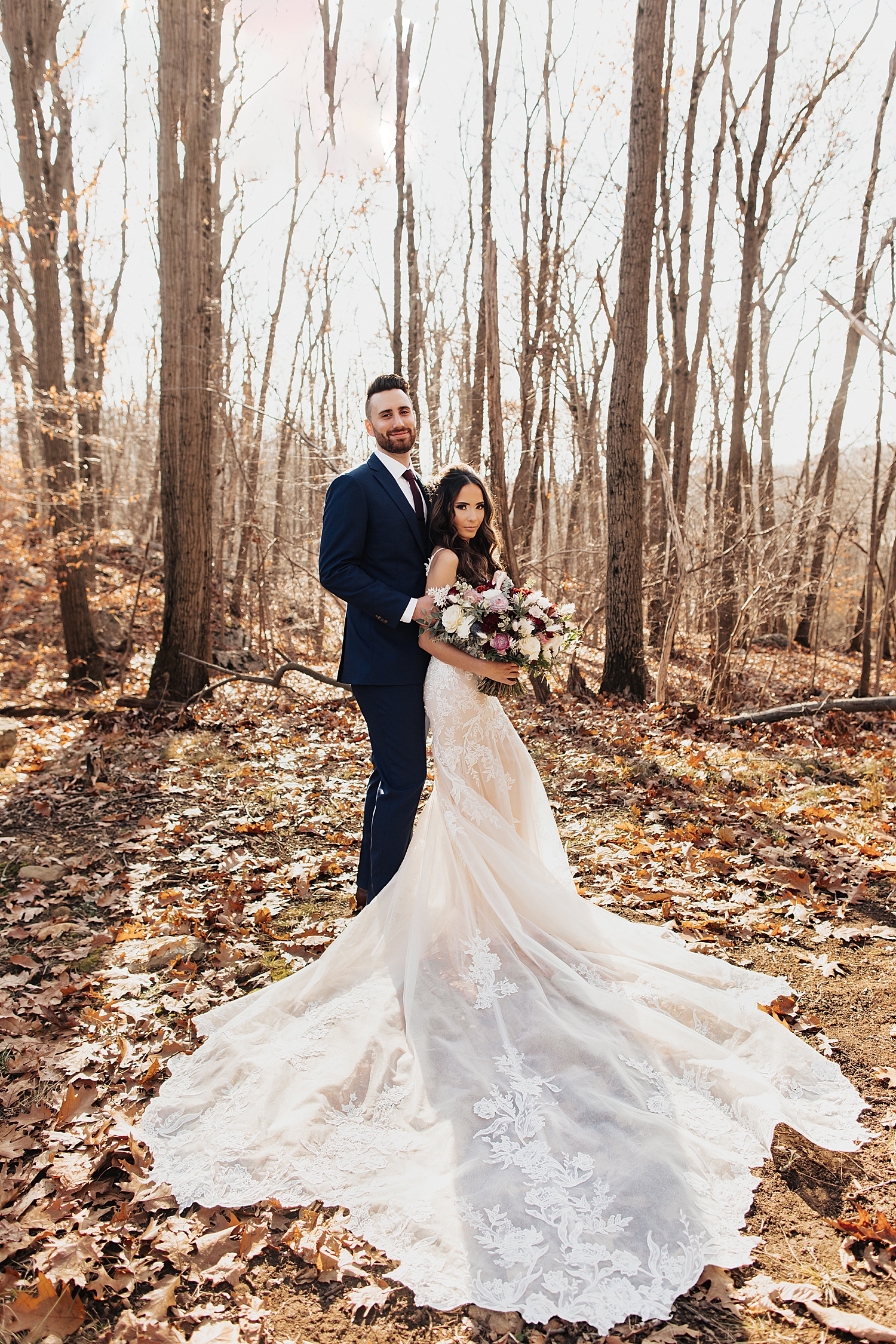 couple embrace in the woods by Nicole Aston Photo
