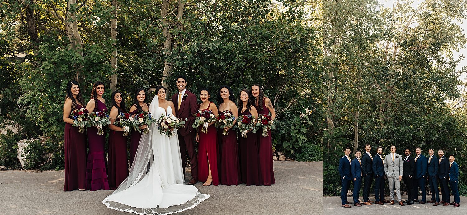 bridal party in wine color dresses and groomsmen in suits surrond newlyweds at Snowbasin