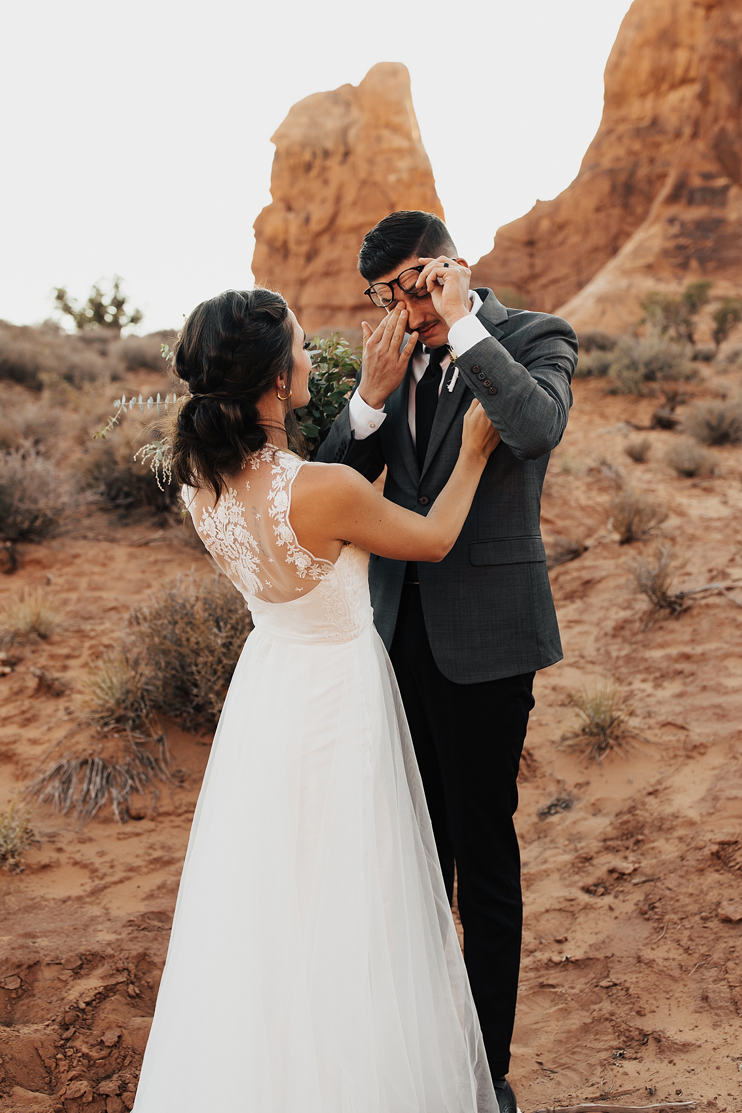 groom cries during first look in the desert by Destination elopement photographer