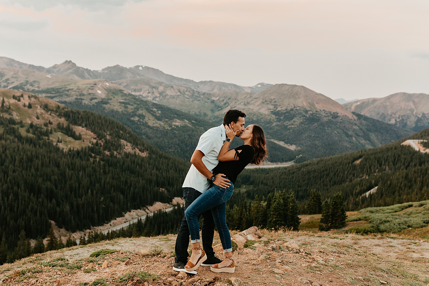 woman is dipped by her partner for kiss at Loveland Pass