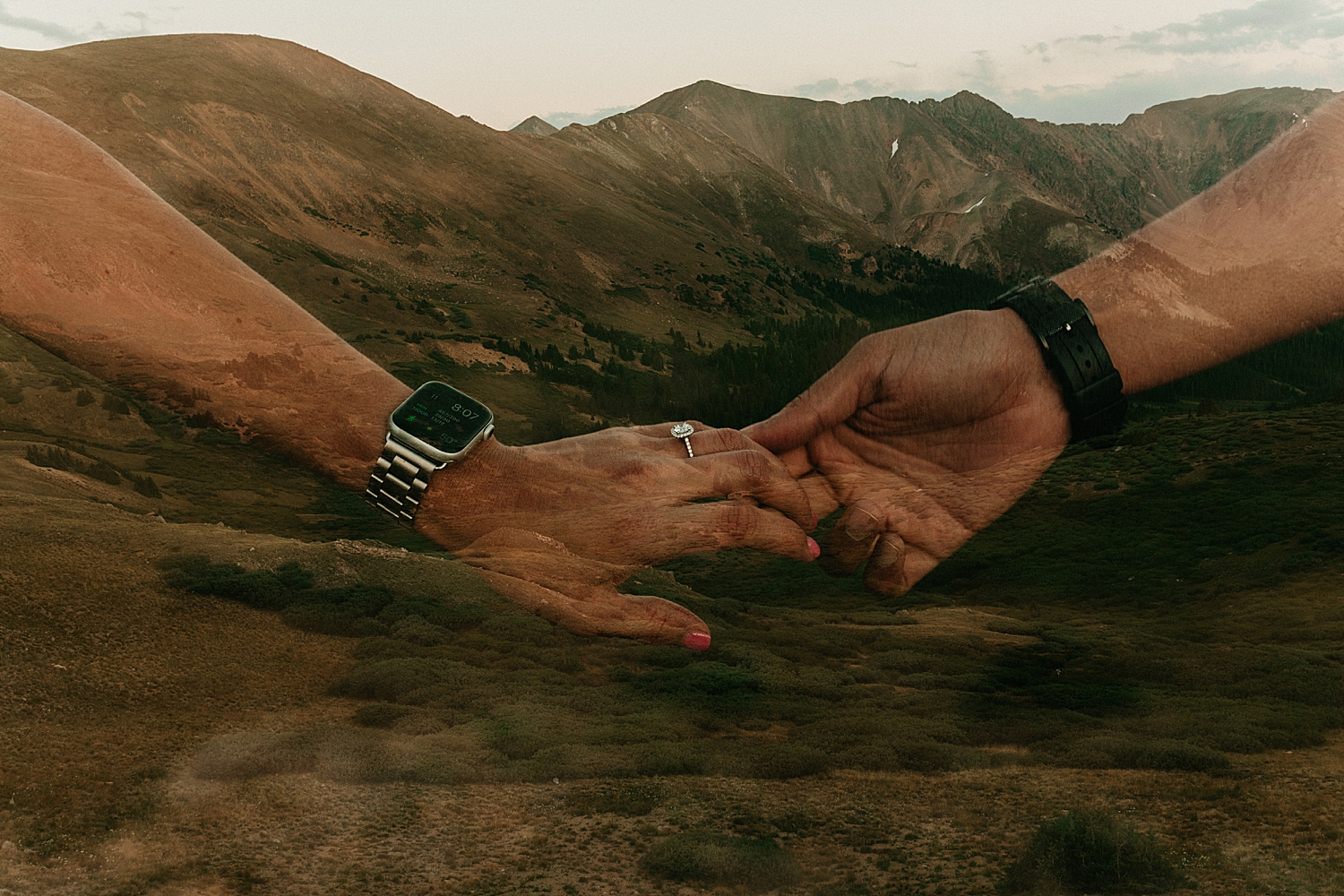 two people hold hands, showing off diamond ring by Nicole Aston Photography