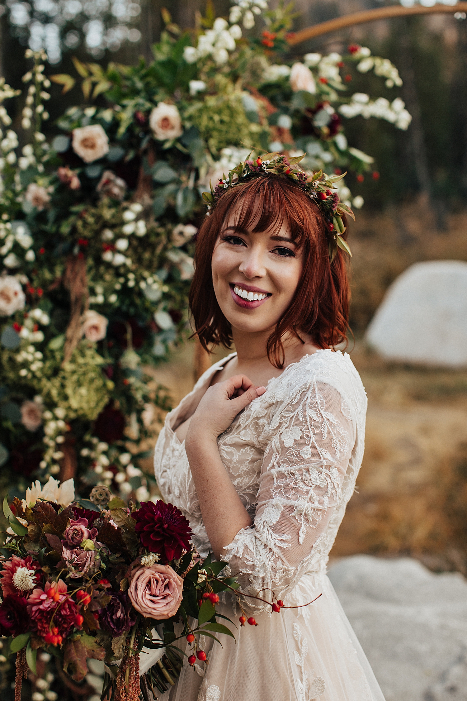 redhead in white lace dress with flower crown by Destination wedding photographer
