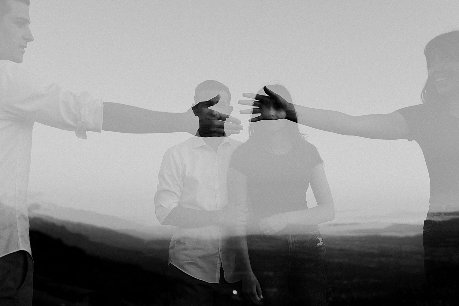husband and wife-to-be reach across for each other for Salt Lake City foothills session