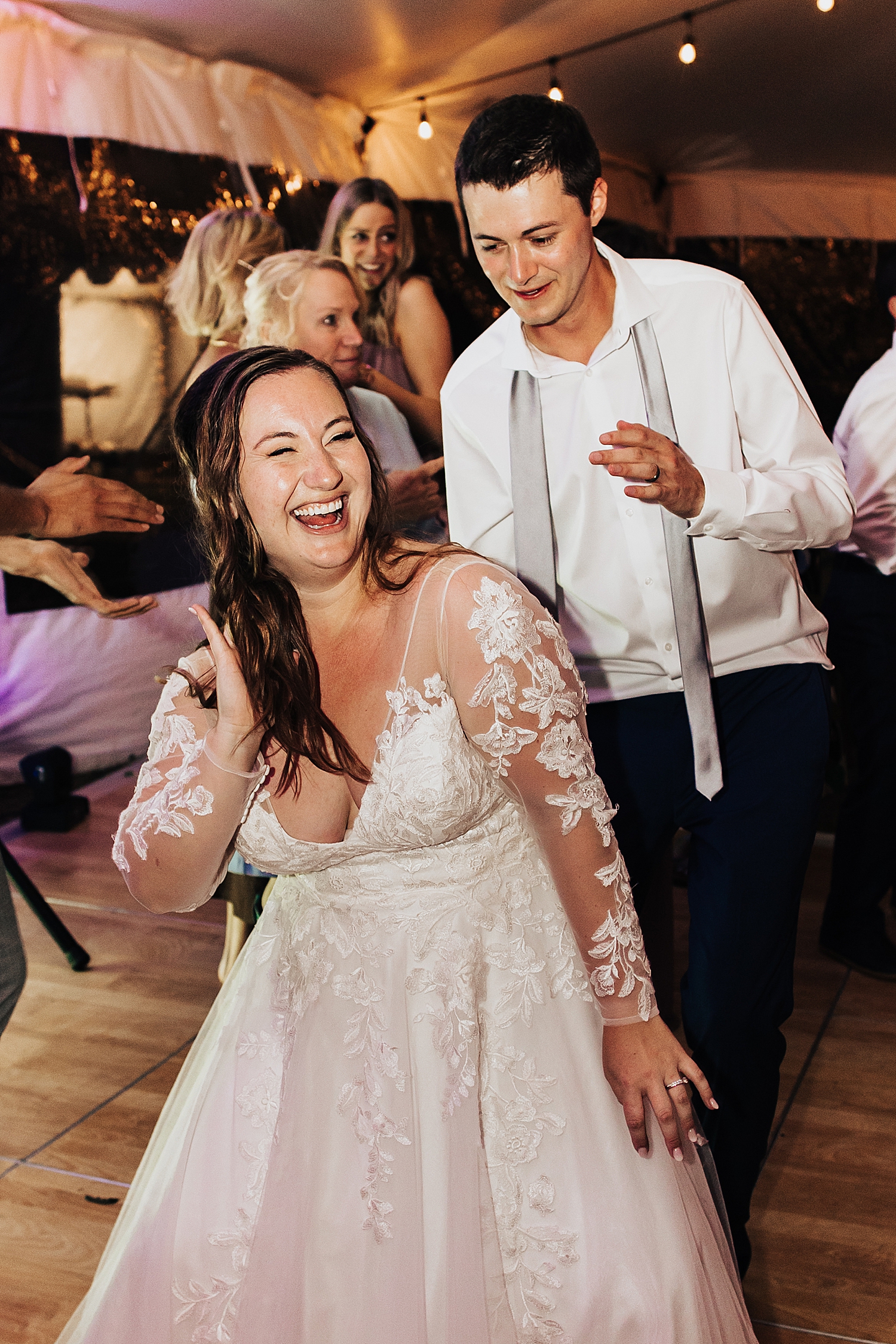 newlyweds dance the night away at tented reception at Snake River Ranch