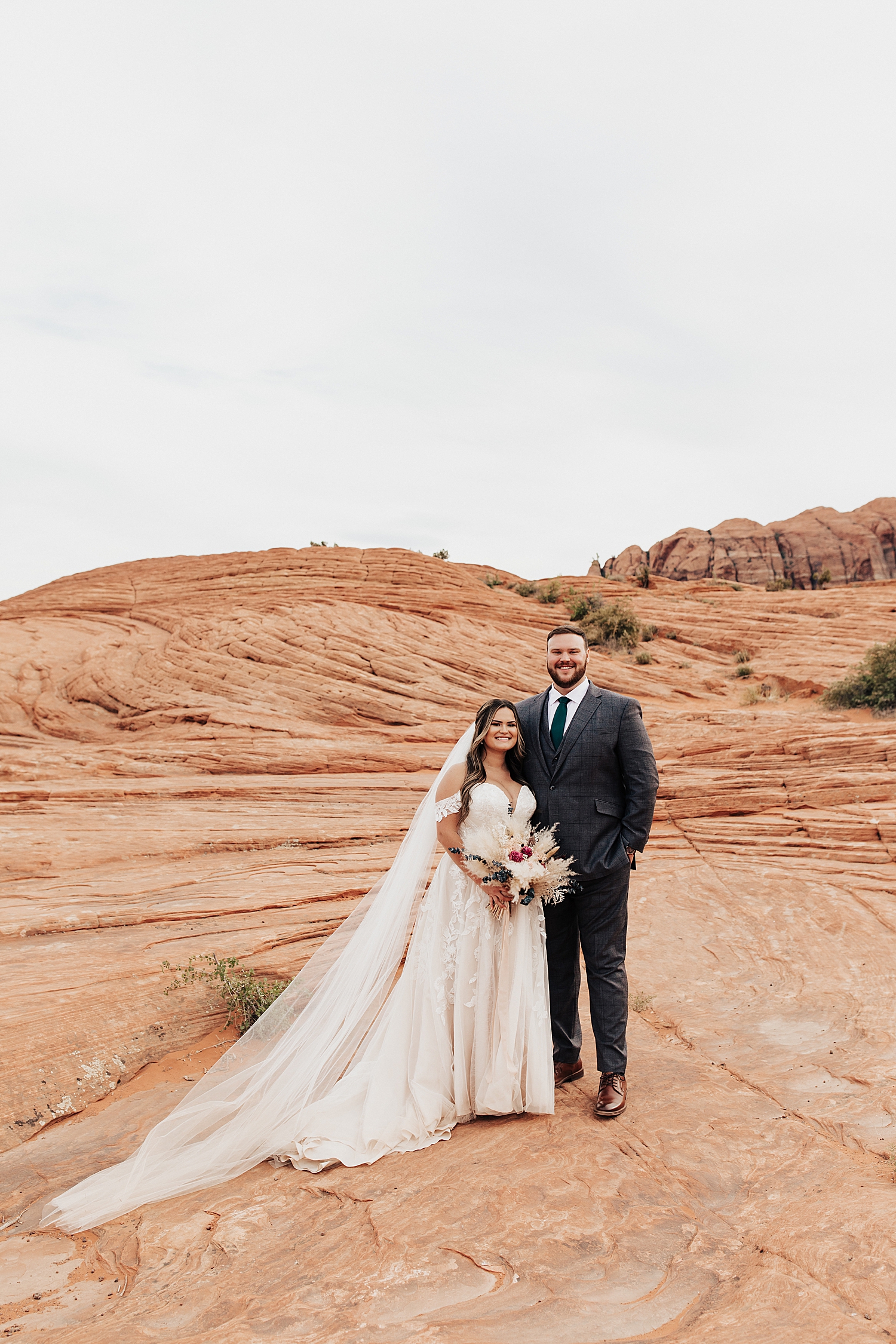 bride and groom smile together after their intimate ceremony outside by Nicole Aston Photography