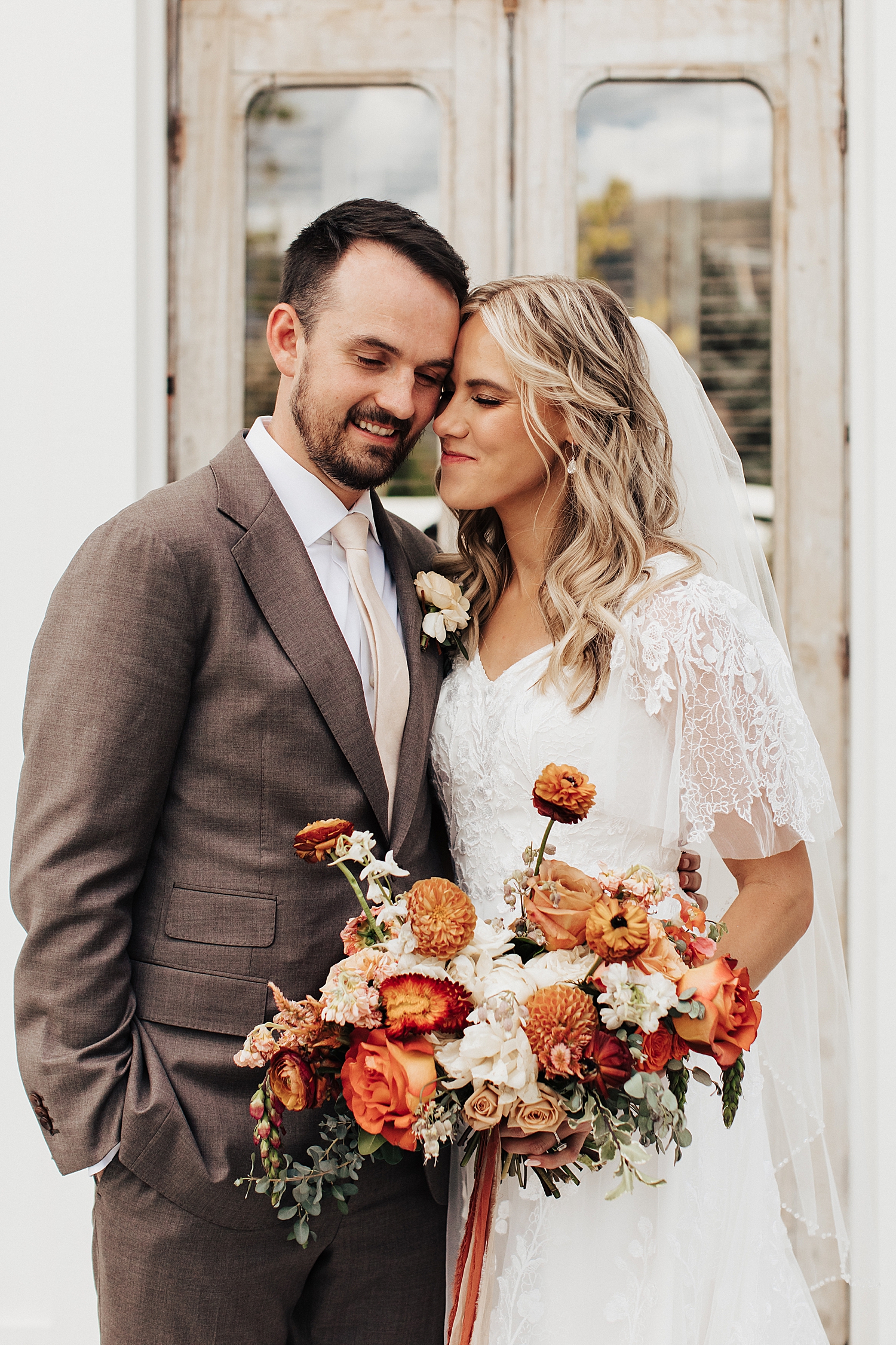 husband and wife lean close together in married bliss by Nicole Aston Photography