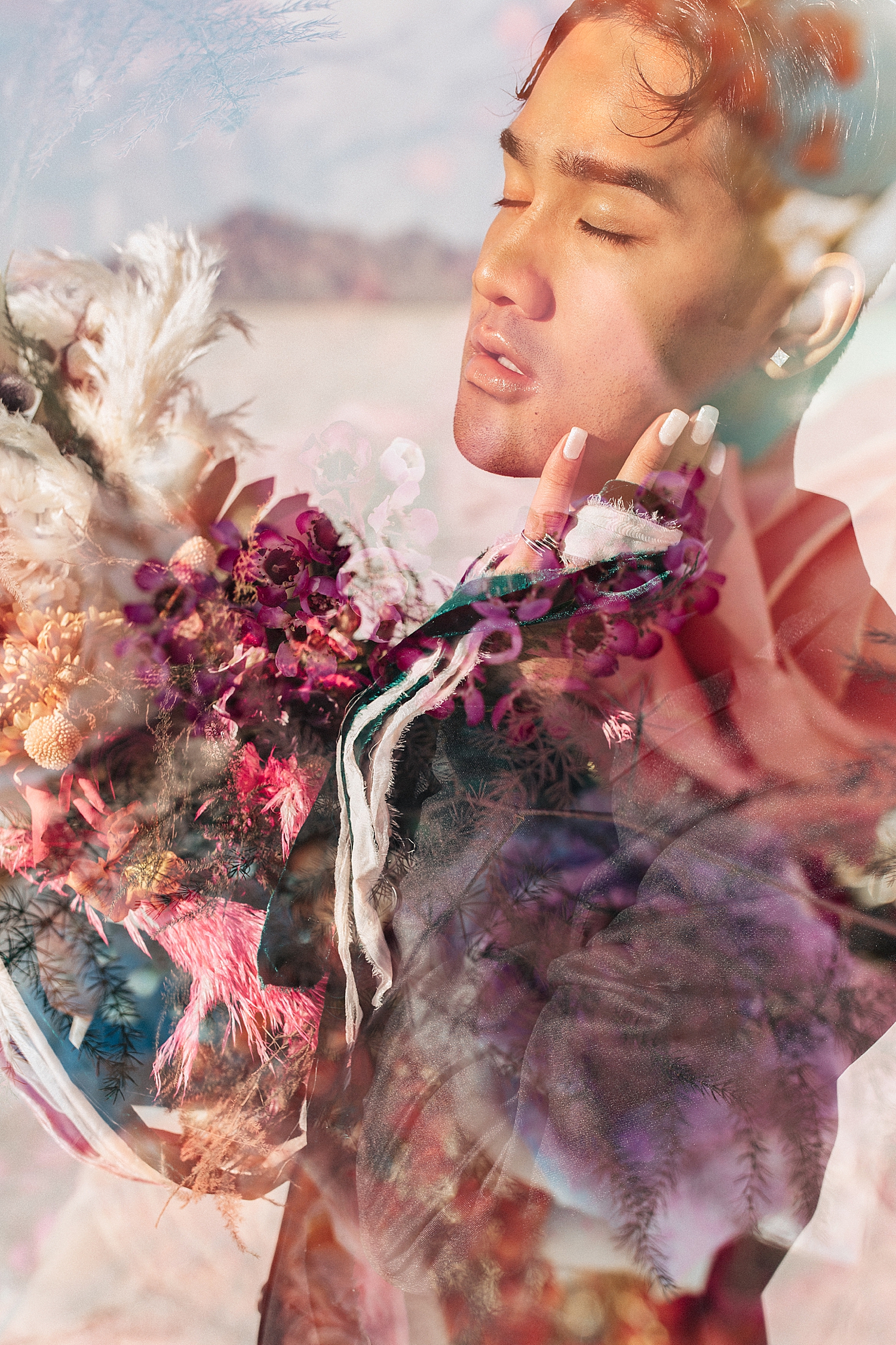 man holds up colorful bouquet on the salt flats by Destination wedding photographer