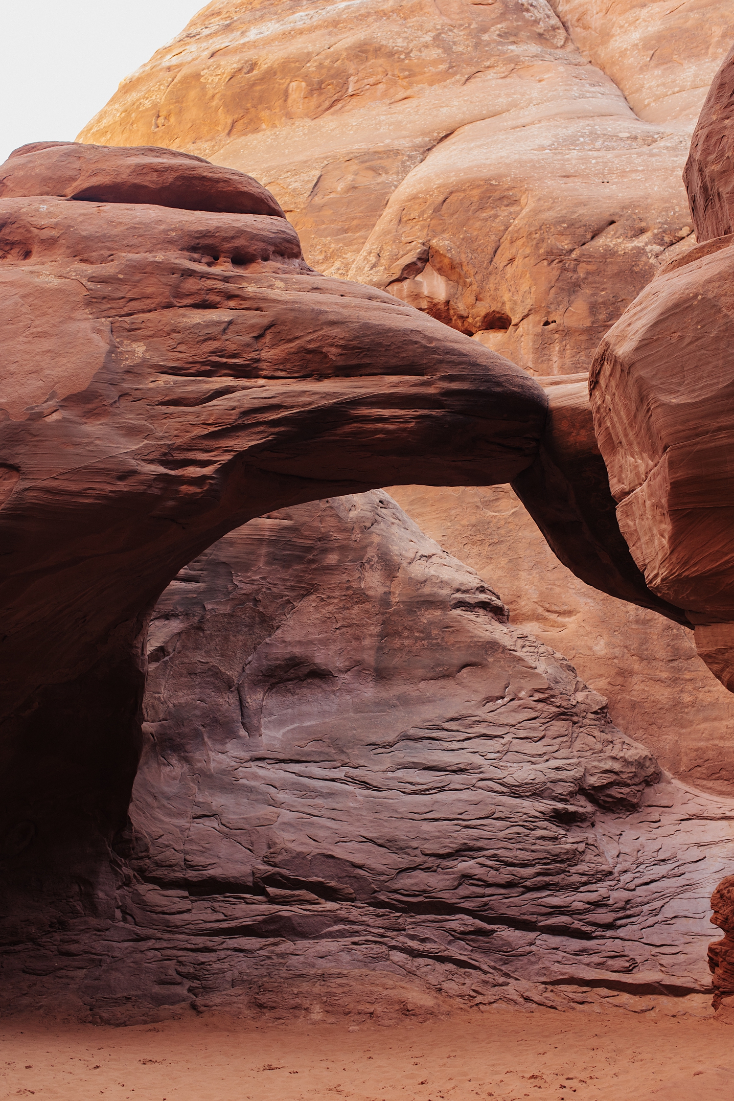 red arches in afternoon lighting by Nicole Aston Photography