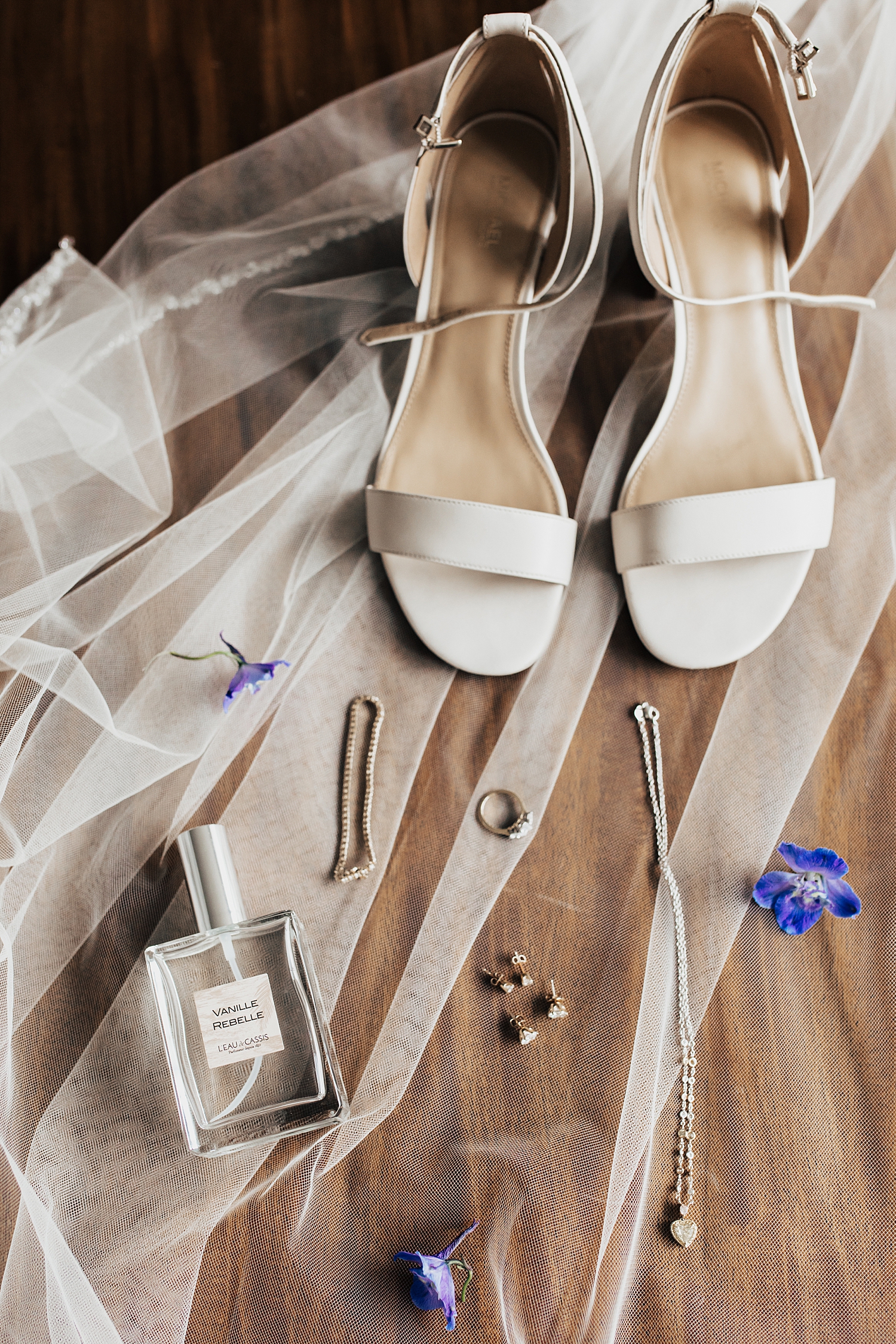 bridal shoes and jewelry laid out on veil for big day at Snowbird Mountain