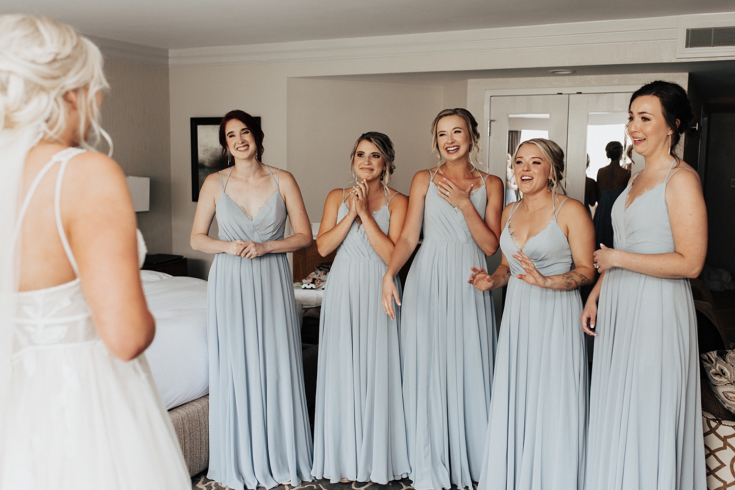 bridesmaids react to seeing friend in her bridal gown by Nicole Aston Photography