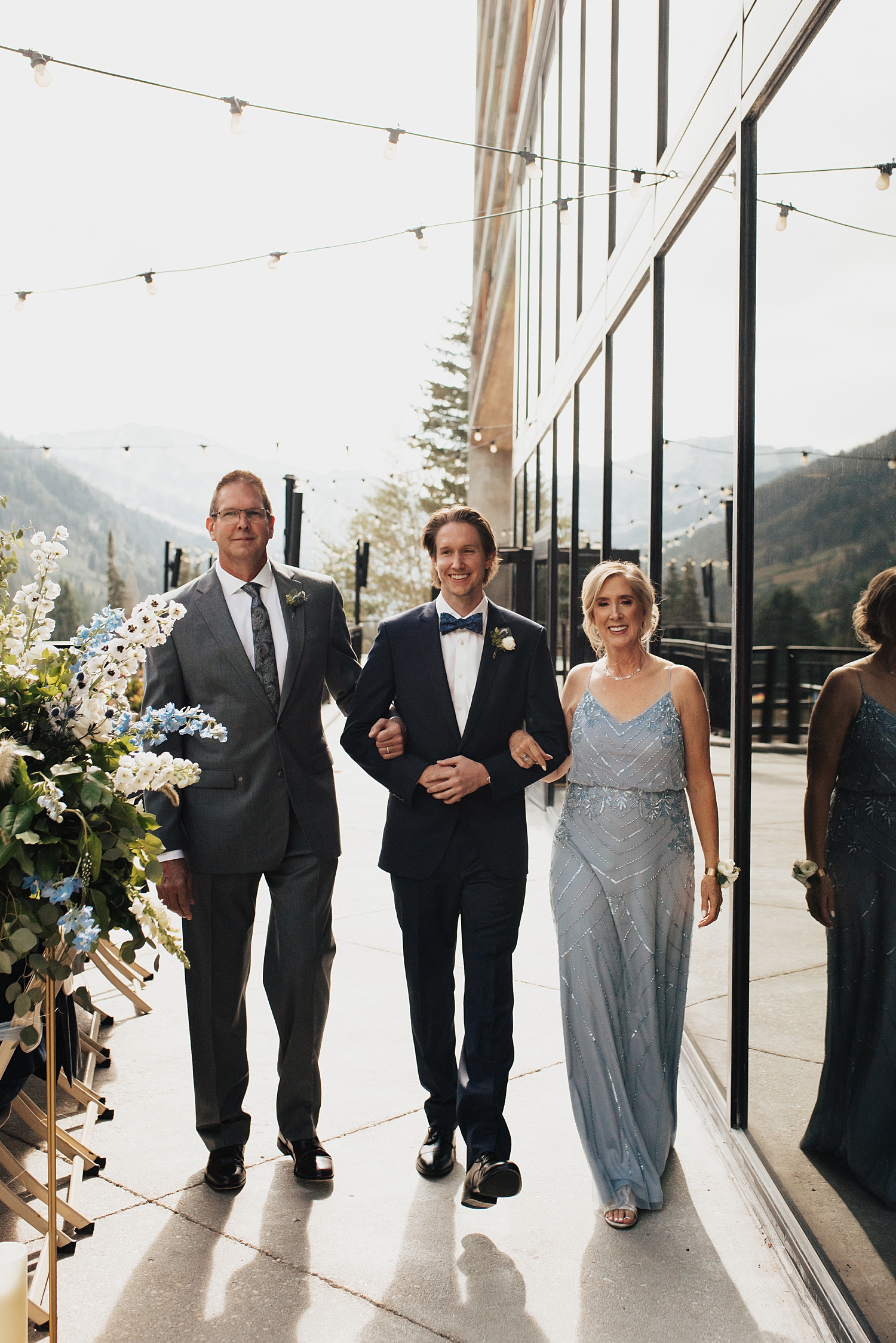 groom walks in his parents for ceremony at Snowbird Mountain
