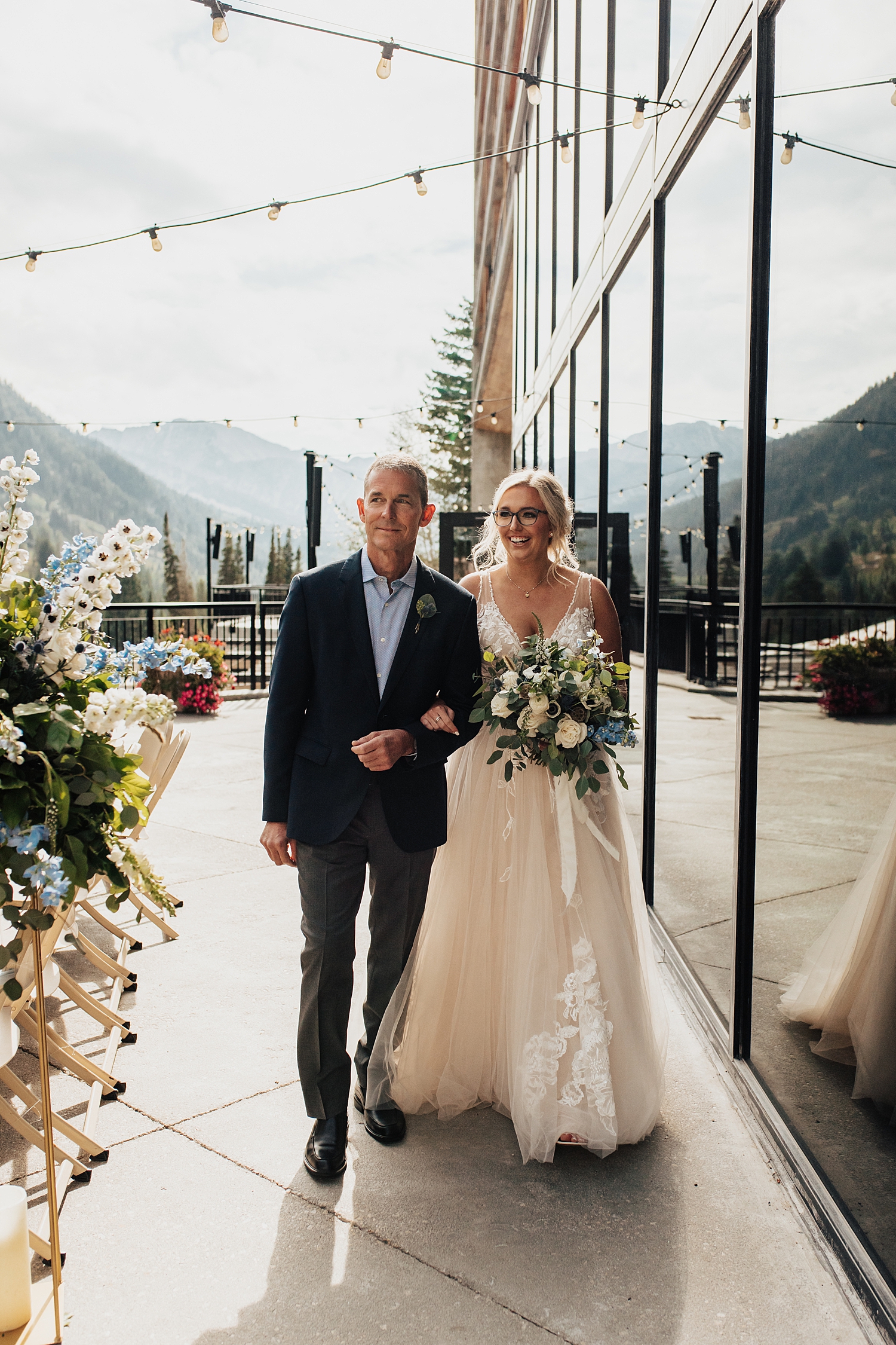 bride walks into ceremony with her father by Destination wedding photographer