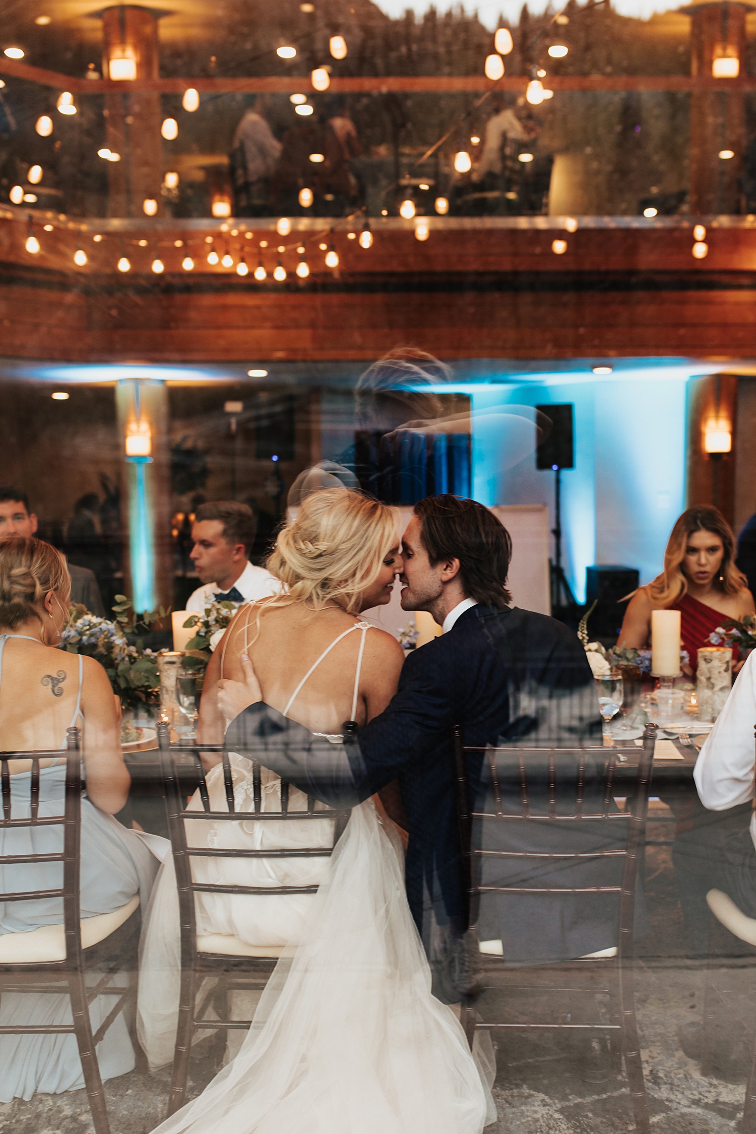 newlyweds share a kiss during reception at Snowbird Mountain