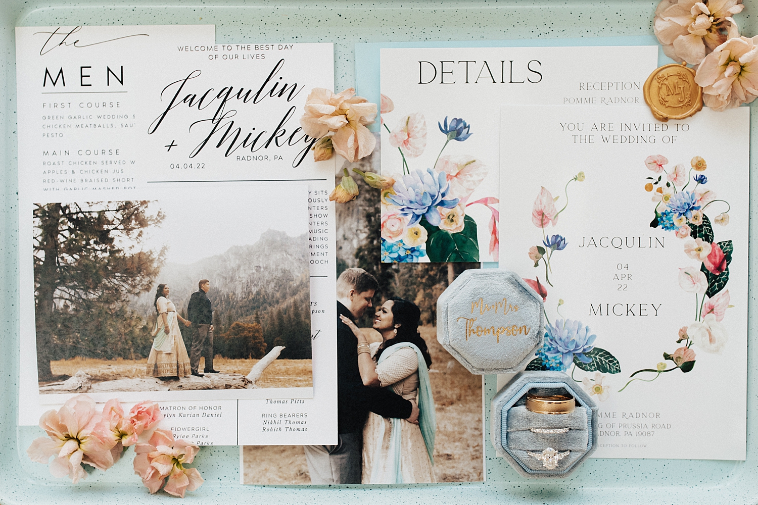 big invitation suite on blue backdrop by Destination wedding photographer