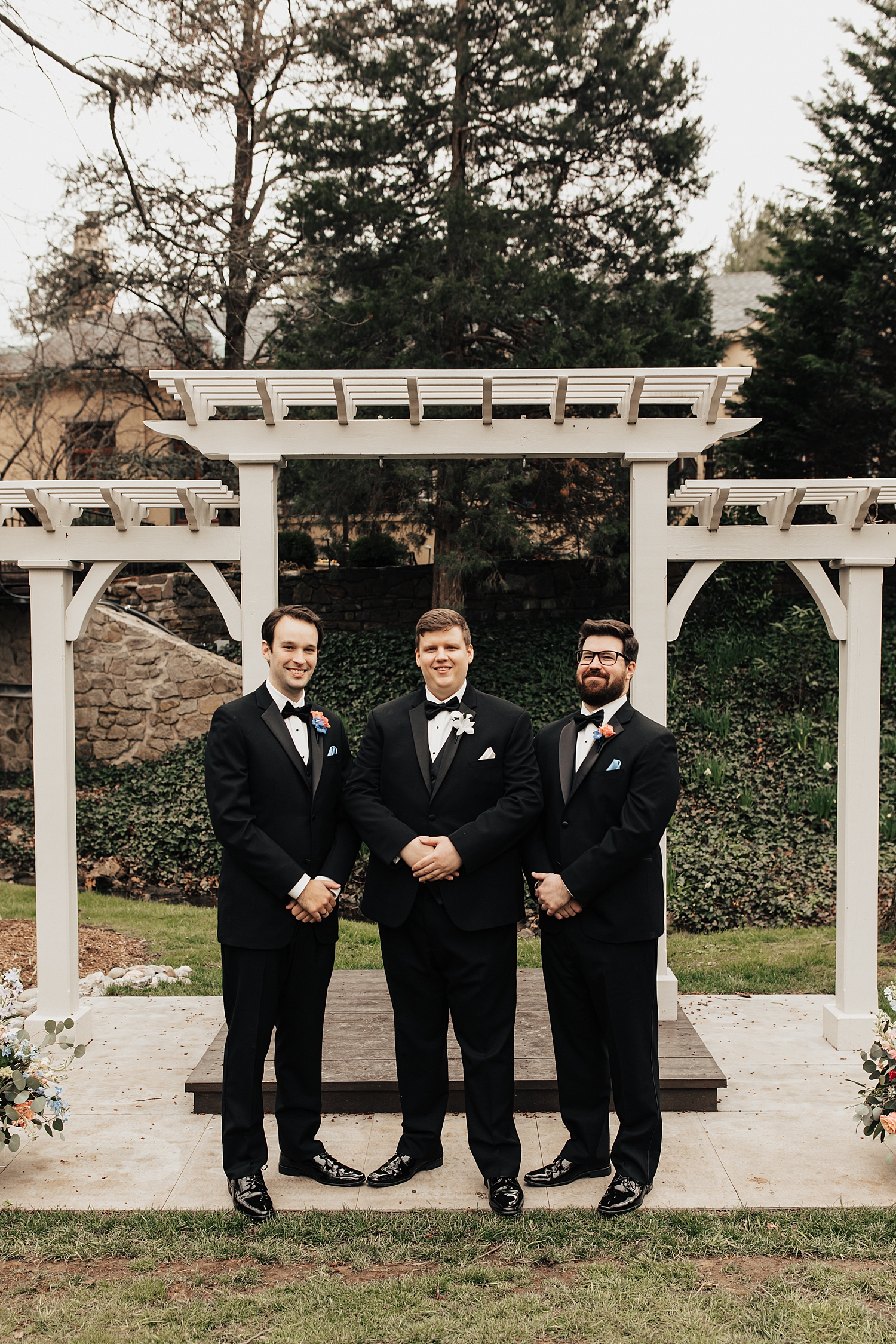 groom stands with groomsmen on alter at Pomme Radnor