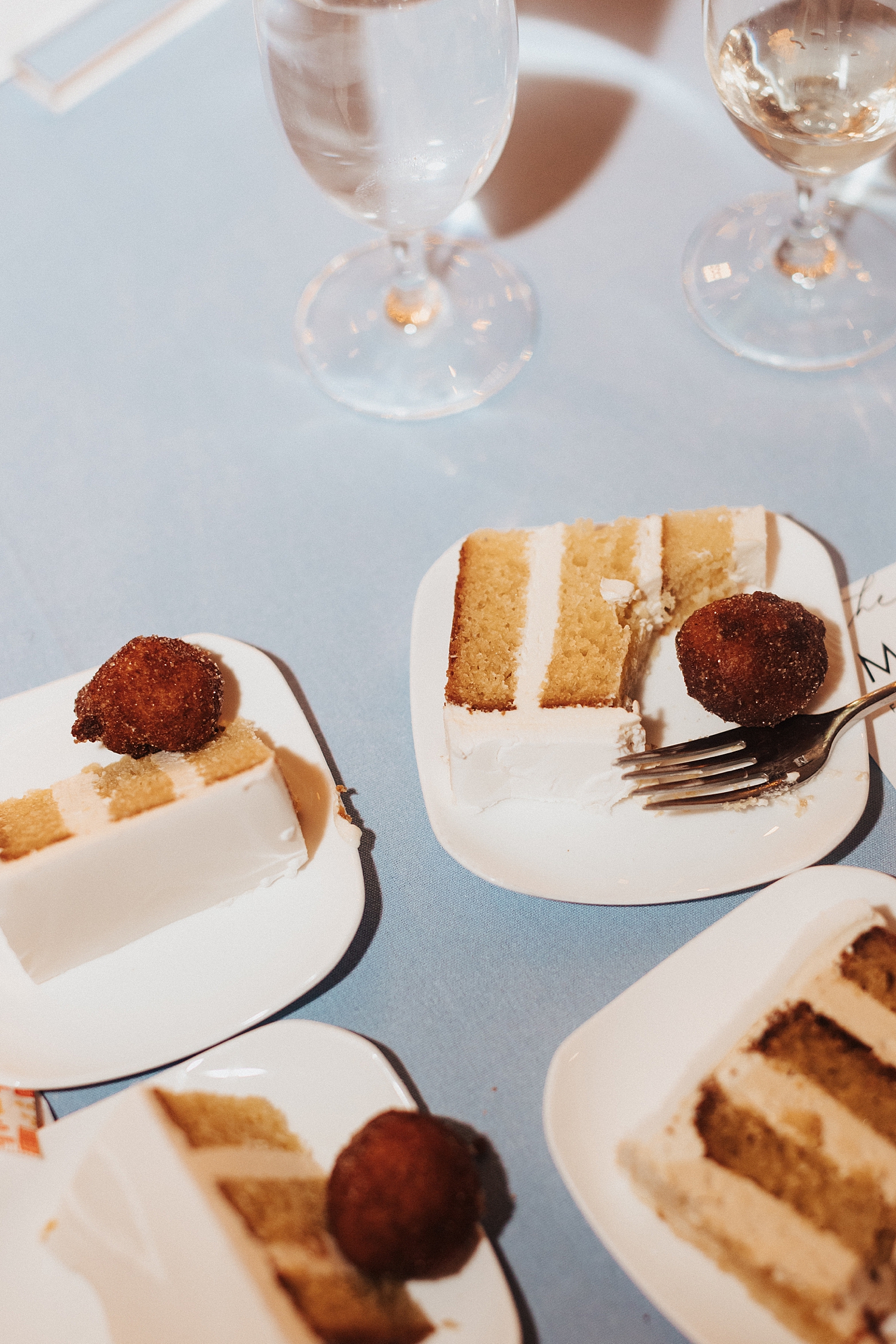 cake slices on blue tablecloth at Pomme Radnor