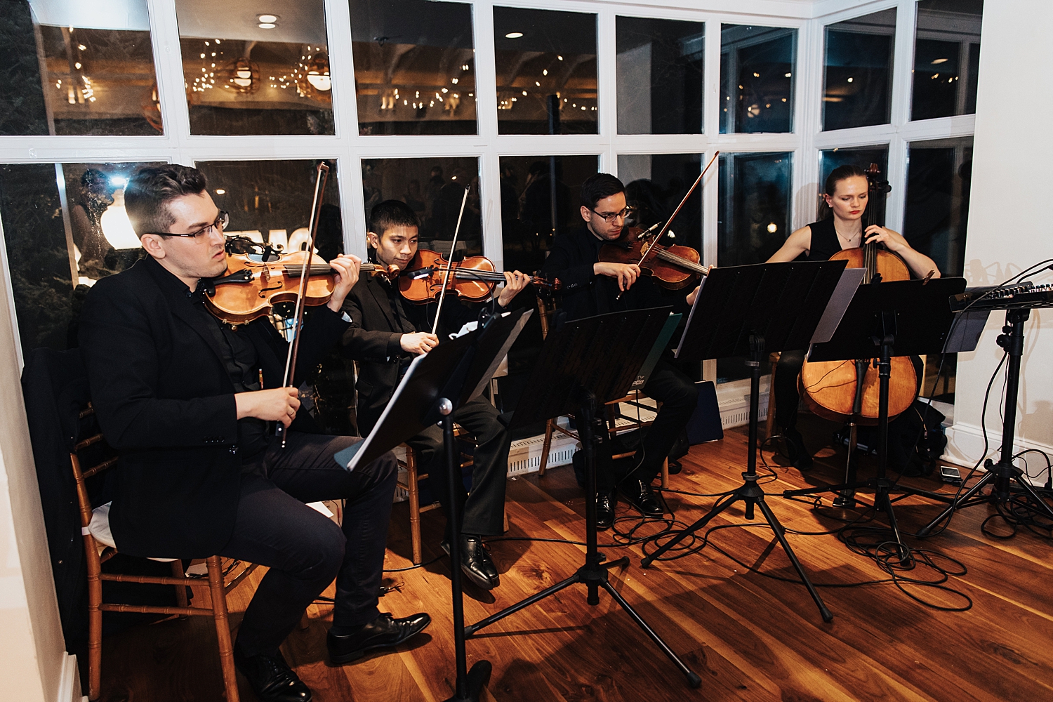 string band plays music during reception by Nicole Aston photography