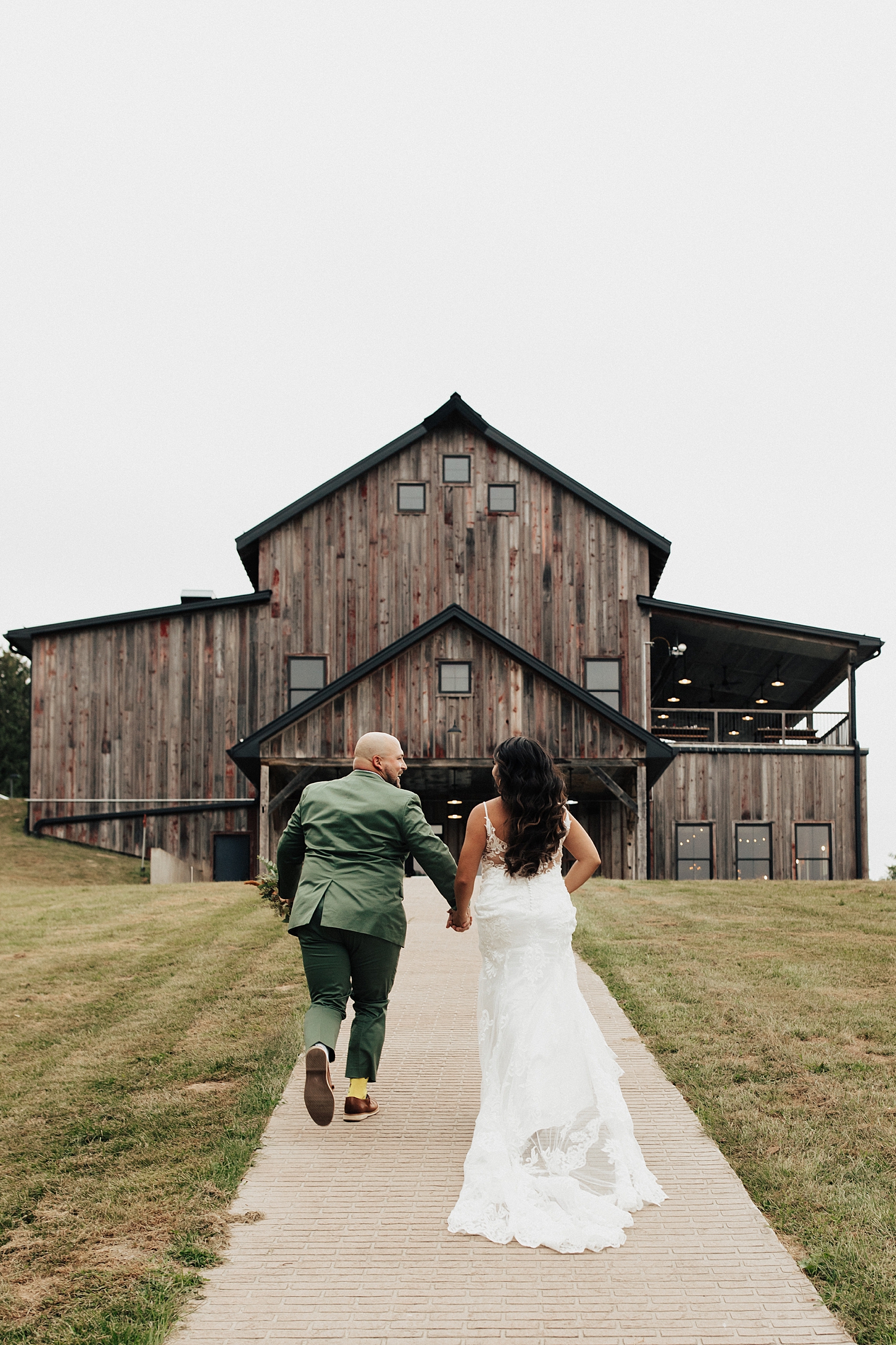 couple walks excitedly together towards their venue by Destination elopement photographer