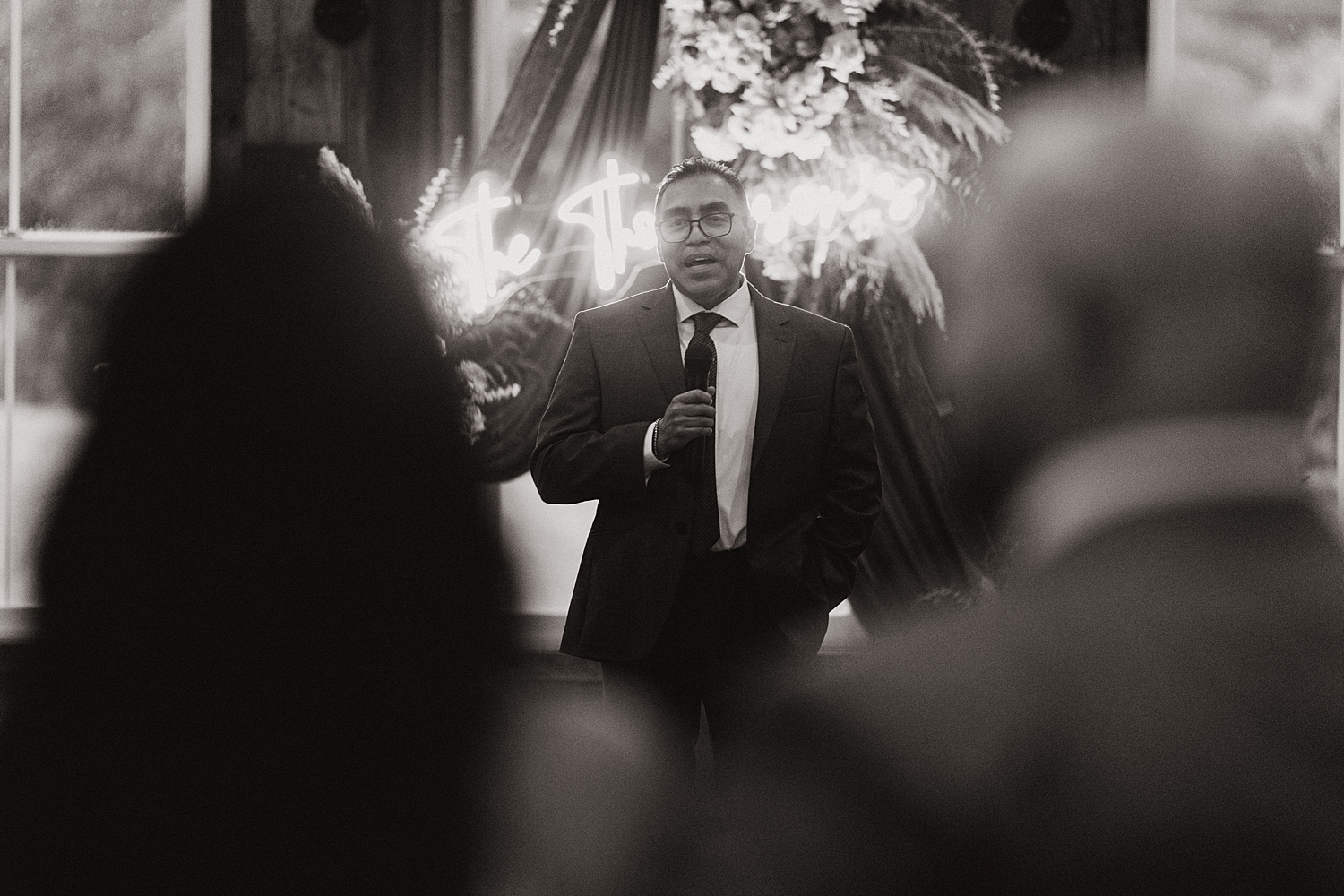 dad gives a toast during reception for Iowa wedding weekend