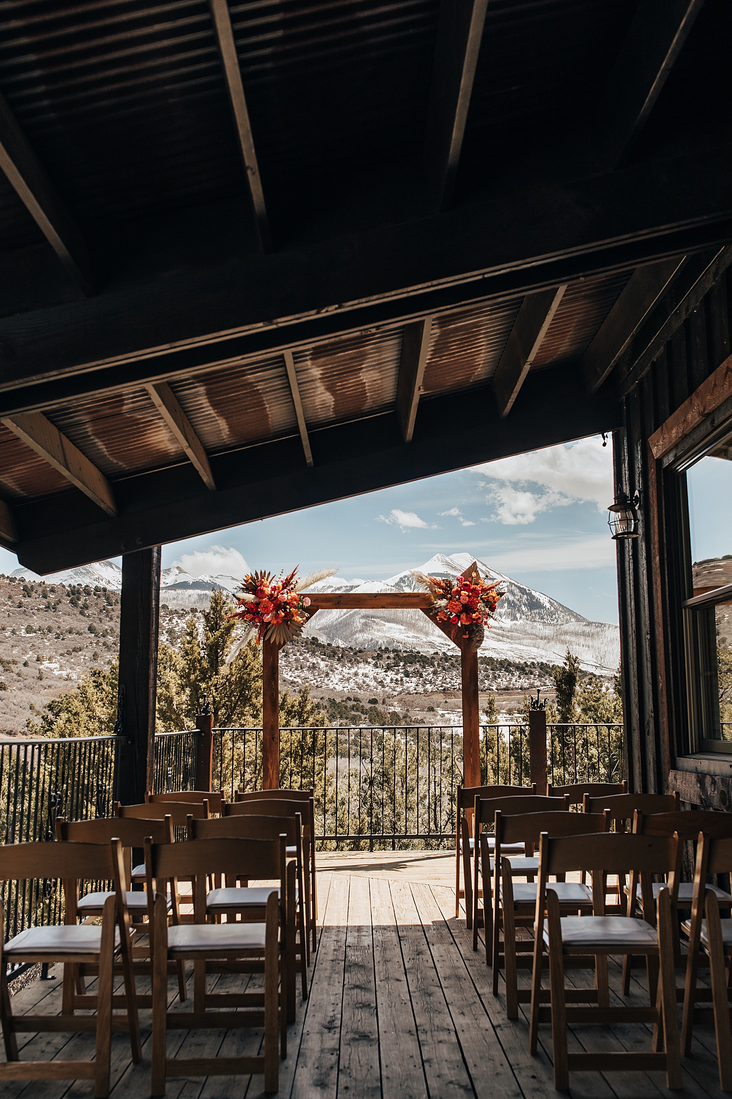 ceremony space set up on porch of venue by Destination wedding photographer