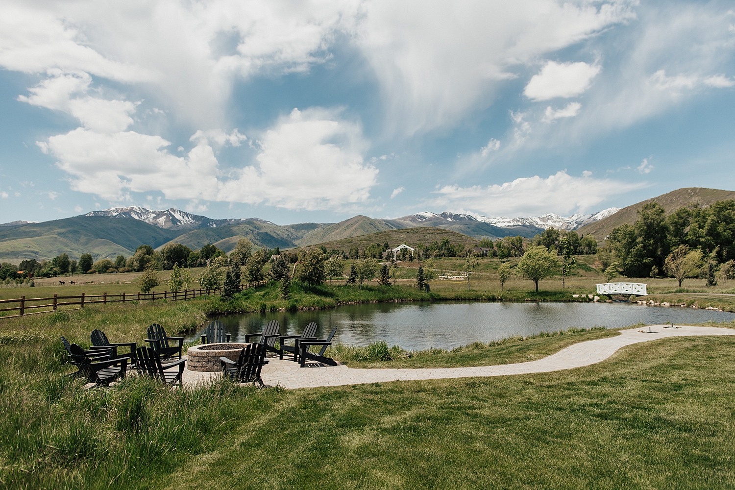 mountains in Utah with a pond and fire pit by Nicole Aston photography