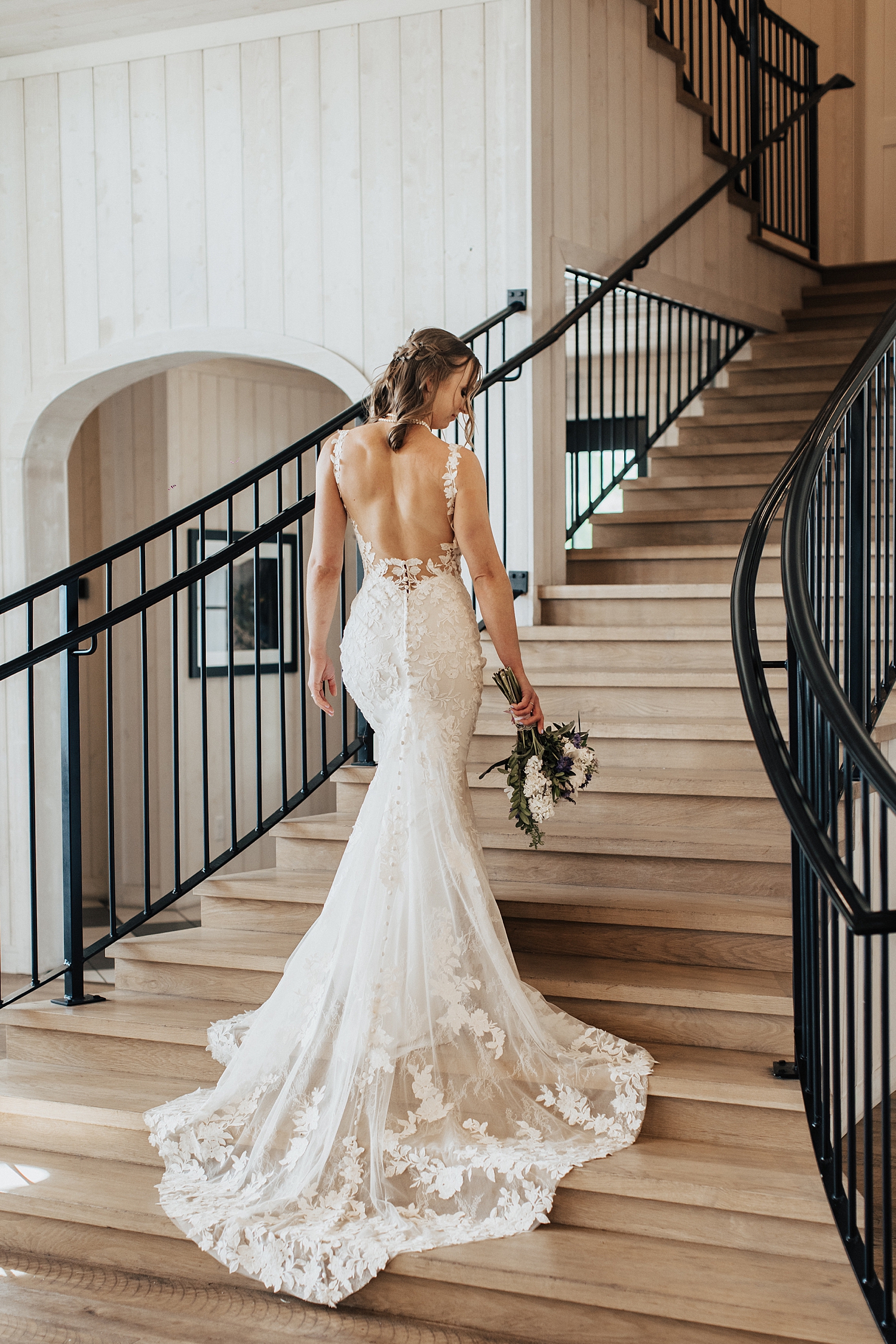 bride walks up elegant staircase by Destination wedding photographer