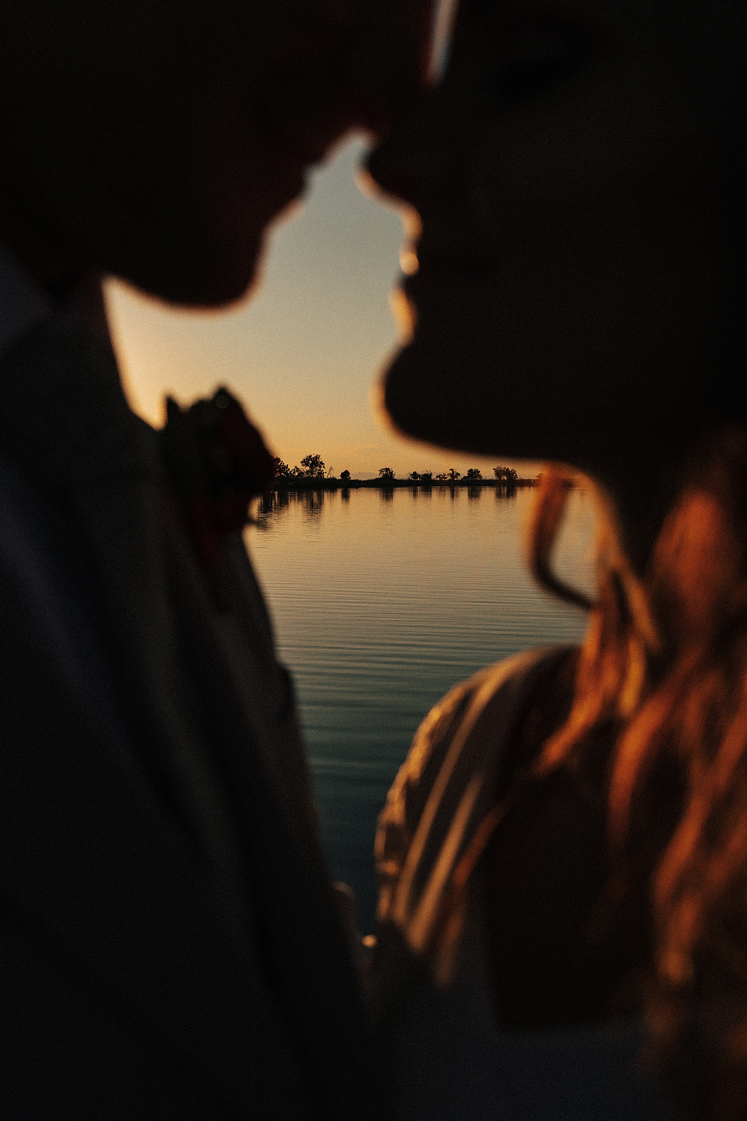 couple lean in for a kiss during bridals at bountiful pond