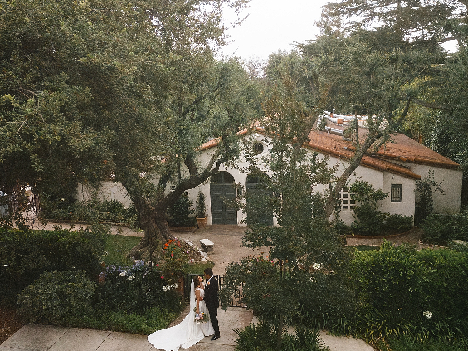newlyweds stand in front of California venue by Nicole Aston Photography