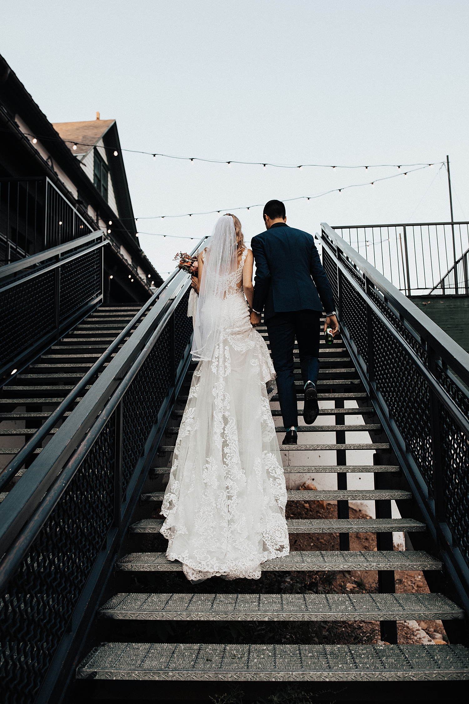 man and woman walk up long staircase at Mid Mountain Lodge in Park City