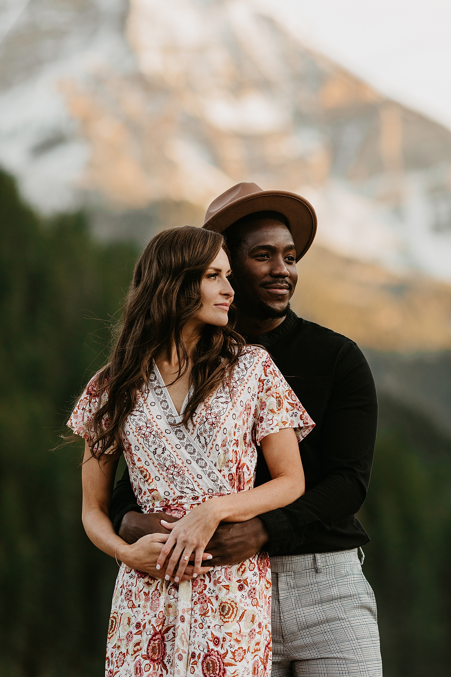 husband and wife stand in front of mountain range in Utah by Nicole Aston Photography