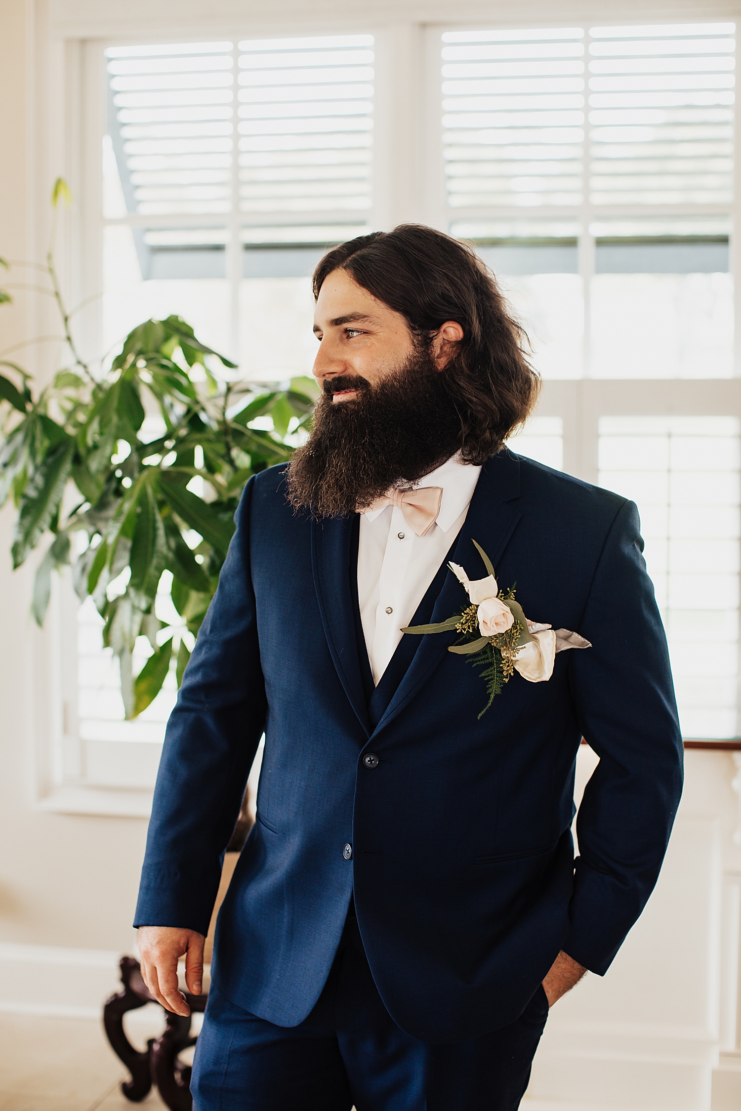 groom with beard in dark blue suit by Nicole Aston Photography