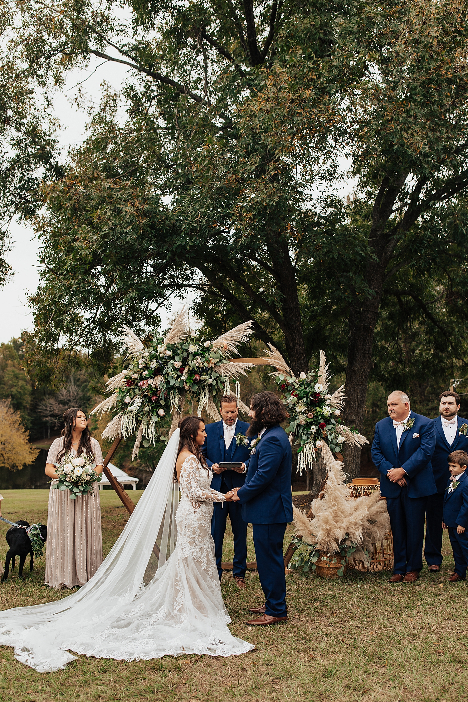 man and woman exchange vows outside at Southern Backyard Wedding